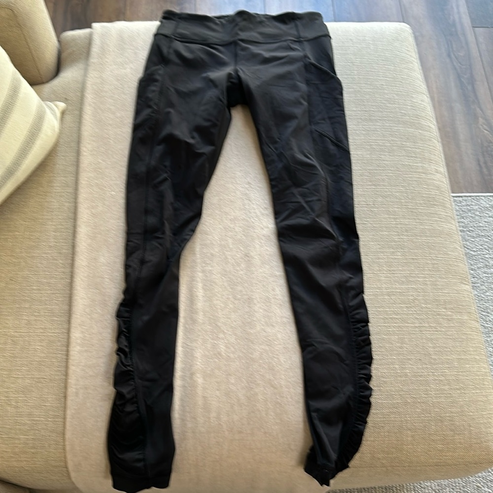 Lululemon leggings with pretty sheer back and gathering from the knee down.